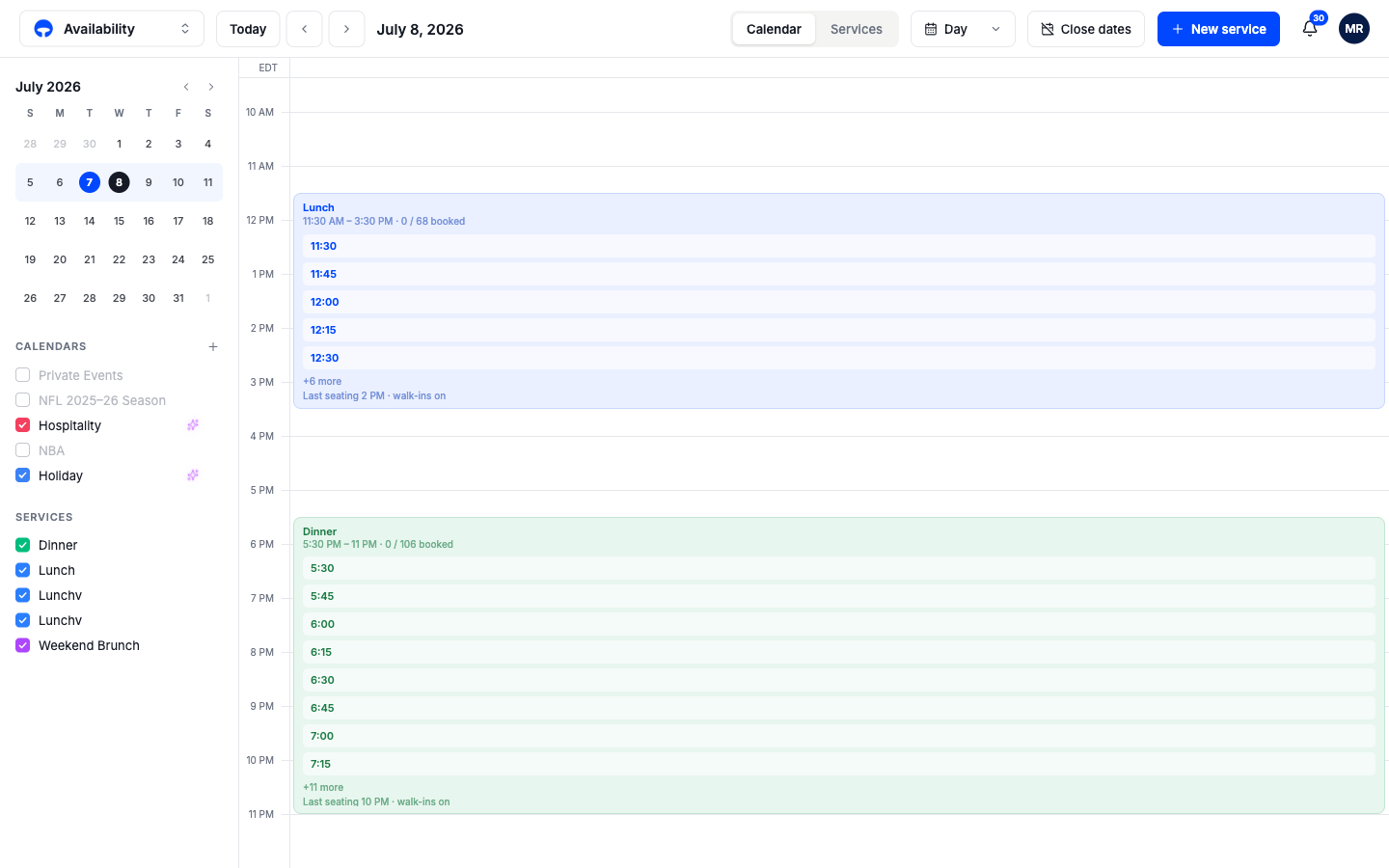 The day view showing Lunch and Dinner cards with booking counts for each time slot